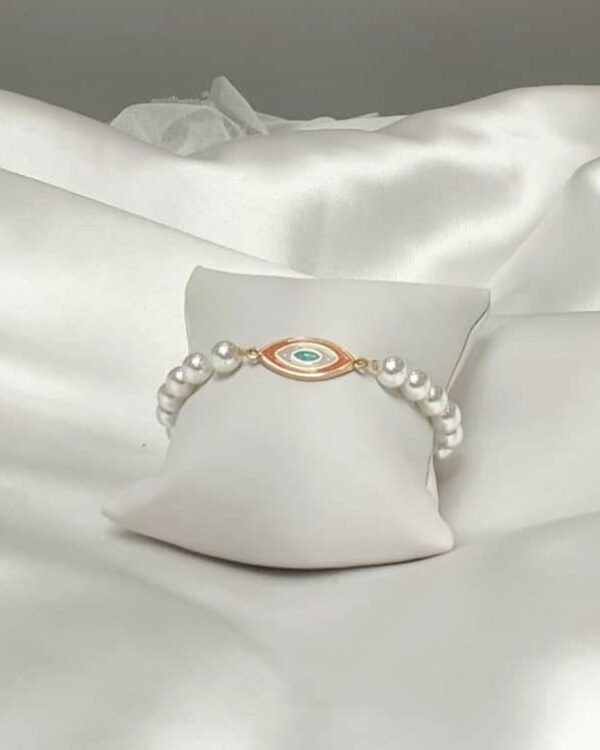 Βραχιόλι με μαργαριτάρια και μάτι με σμάλτο
