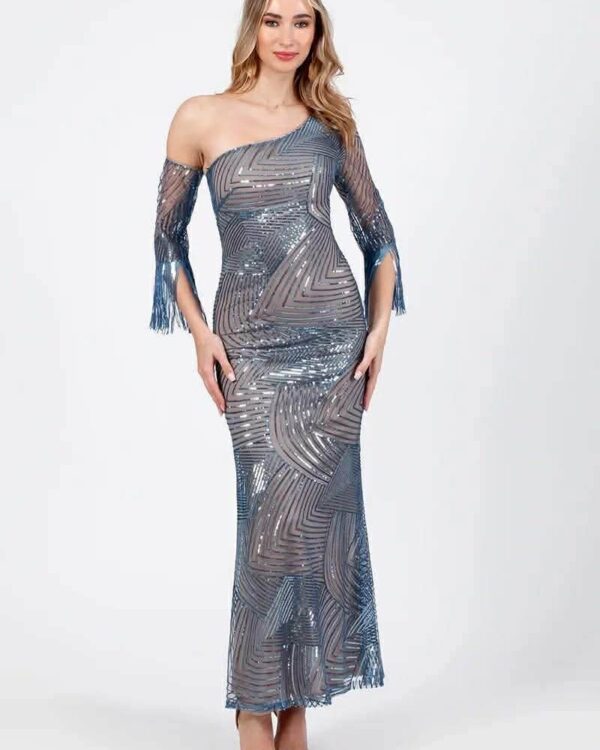 Woman in a blue-gray one-shoulder sequined gown with fringe sleeves, posing against a light background that emphasizes the dress's shine and pattern.