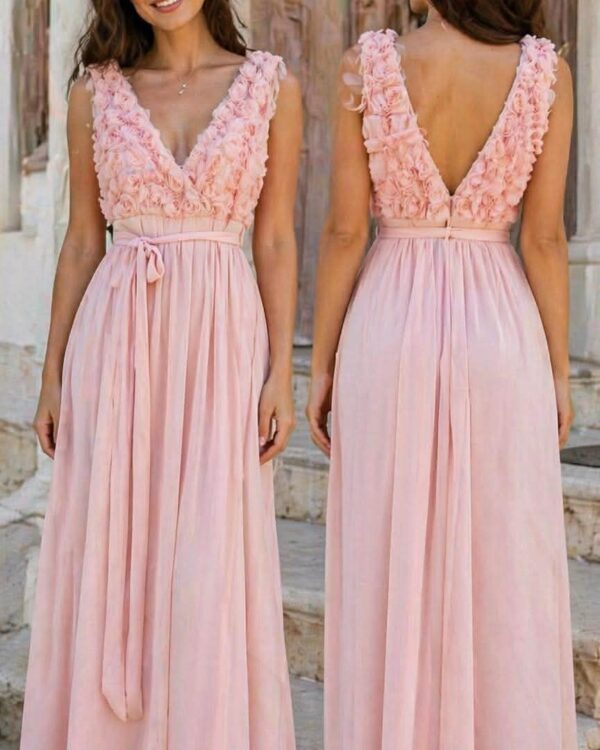 Two women in blush pink, floor-length gowns with a ruffled floral bodice, standing on stone steps (front and back views).