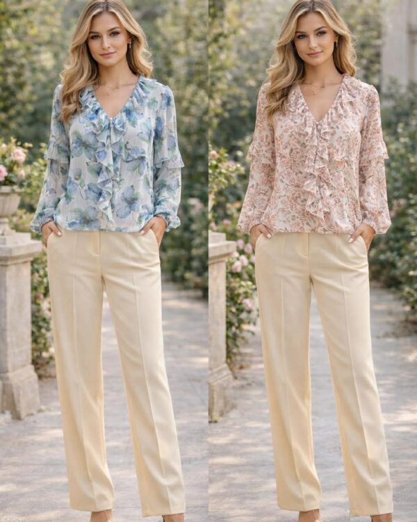 Two models stand side by side in a garden, wearing blue and pink floral ruffled blouses with cream trousers, MissVanity branding above them.